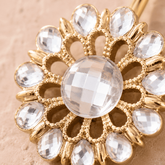Close up of checkerboard cut clear CZ gems on gold plated flower navel ring, maximum sparkle yellow gold detail