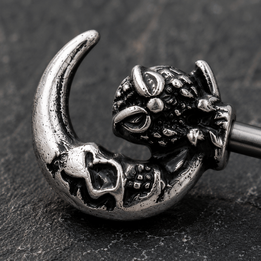 Close up of gothic owl crescent moon skeleton key design on nipple bar, 316L stainless steel zinc alloy detail