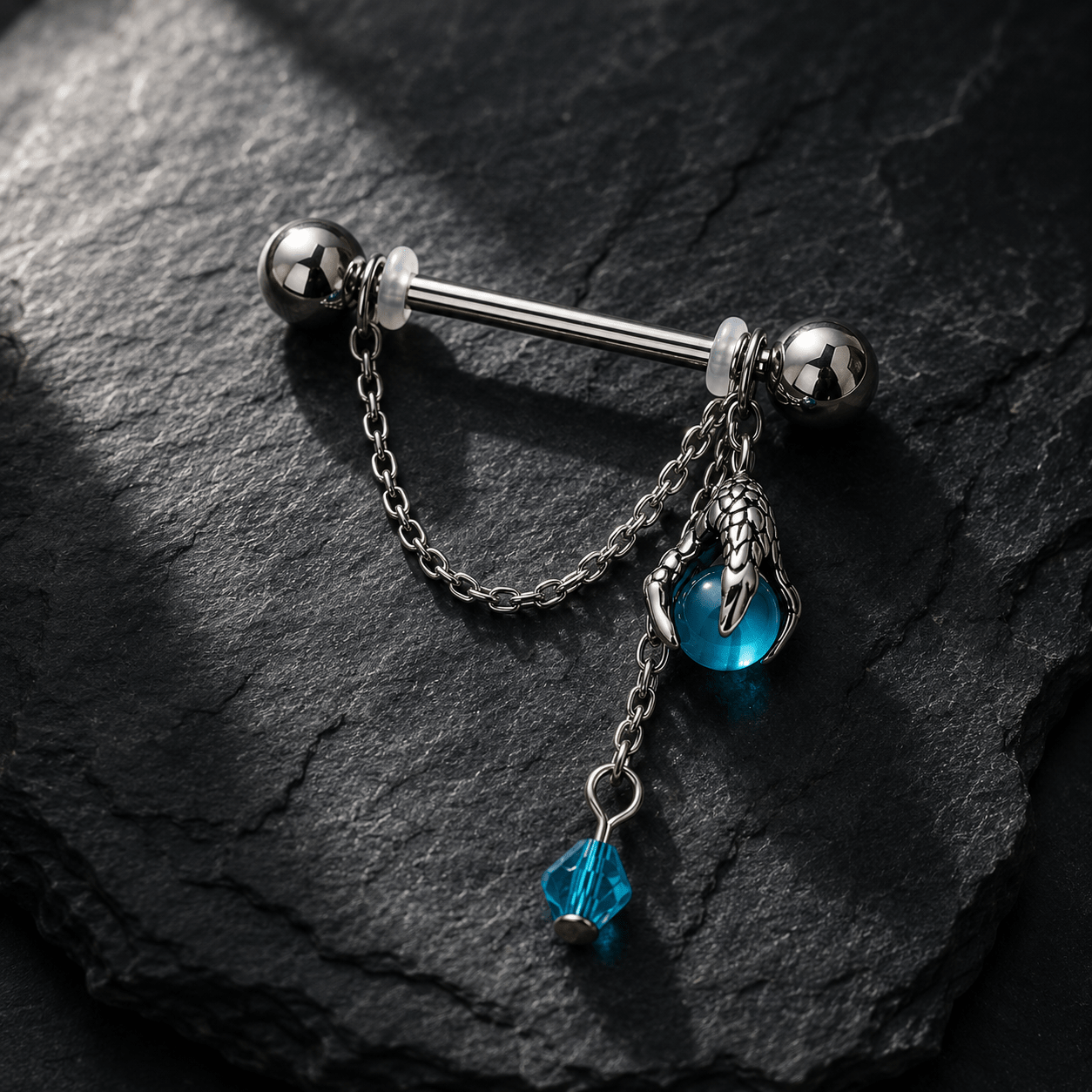 Dragon claw aqua orb body jewelry pair flat lay