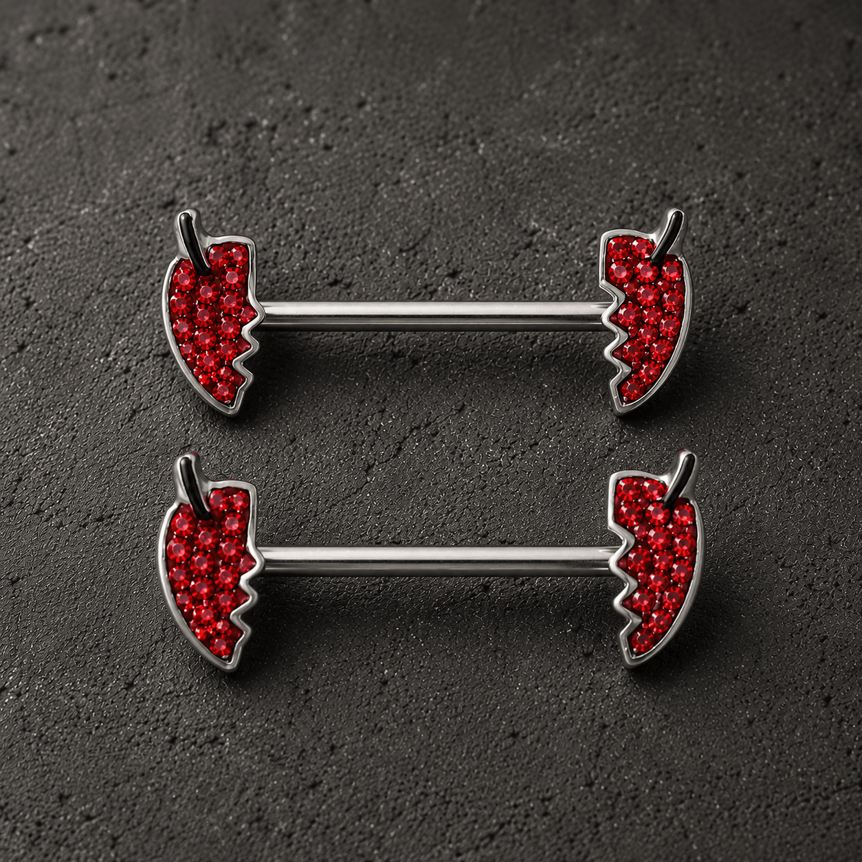 Jeweled devil's heart body jewelry pair detail
