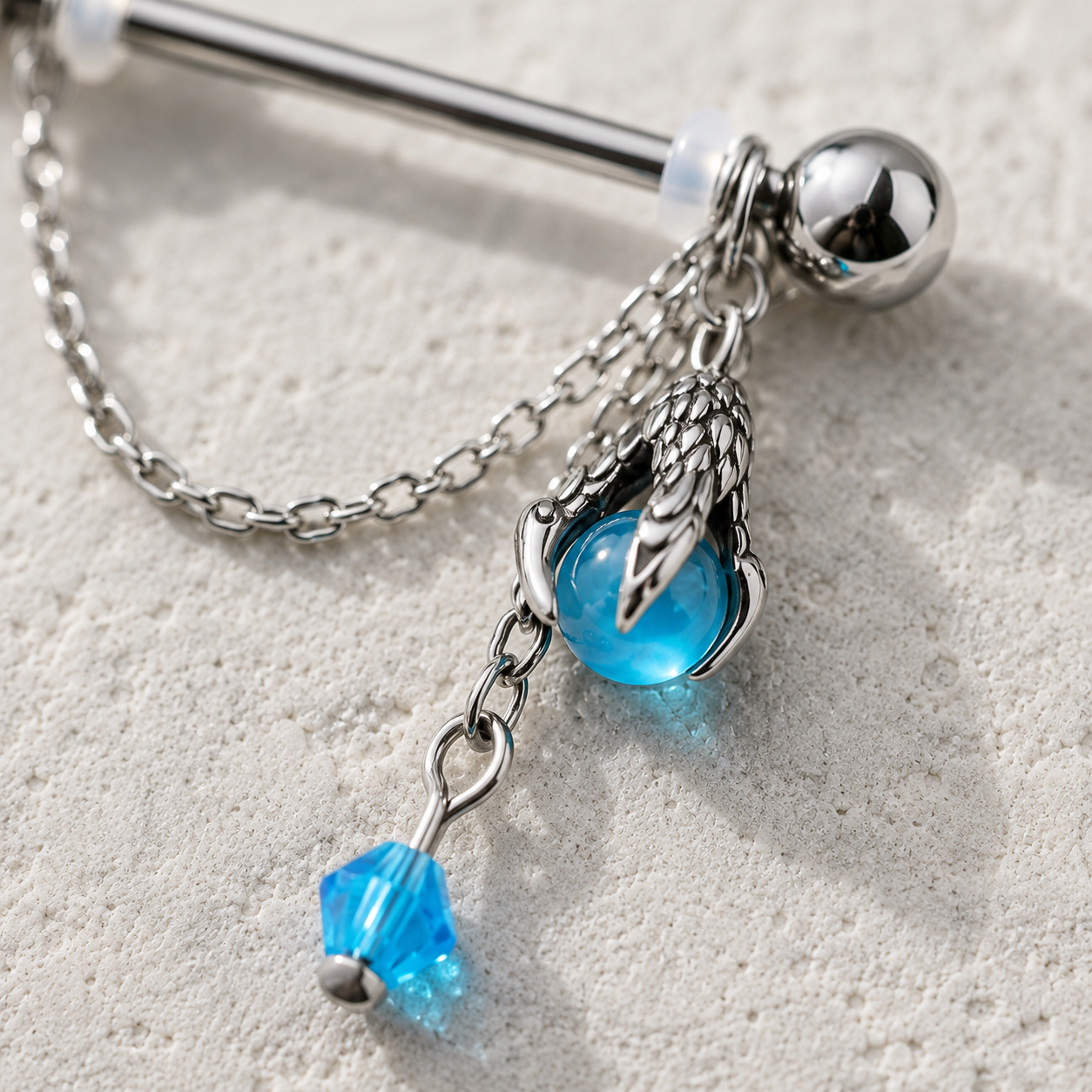 Dragon claw and aqua orb body jewelry detail