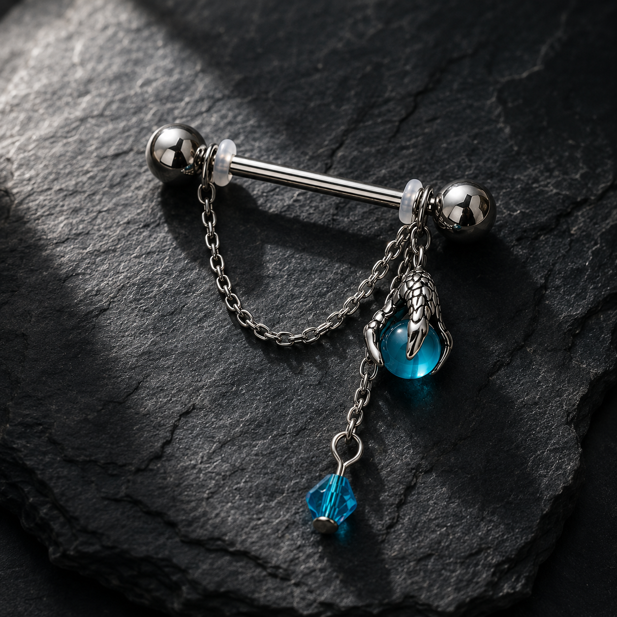 Dragon claw aqua orb body jewelry pair flat lay