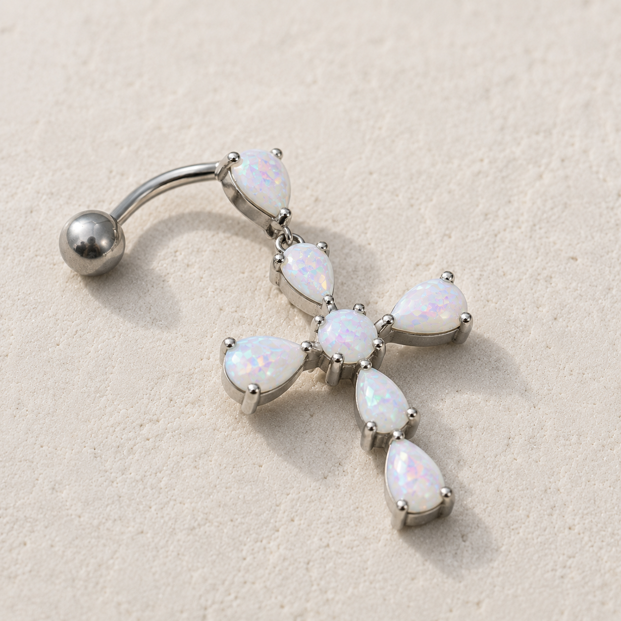 Side view of white opal cross top down navel ring, 14G 316L stainless steel, 18 x 22mm cross design