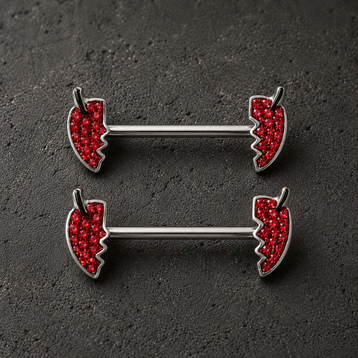 Jeweled devil's heart body jewelry pair detail