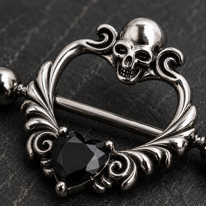 Close up of skull design top and black heart CZ on heart shaped nipple shield detail