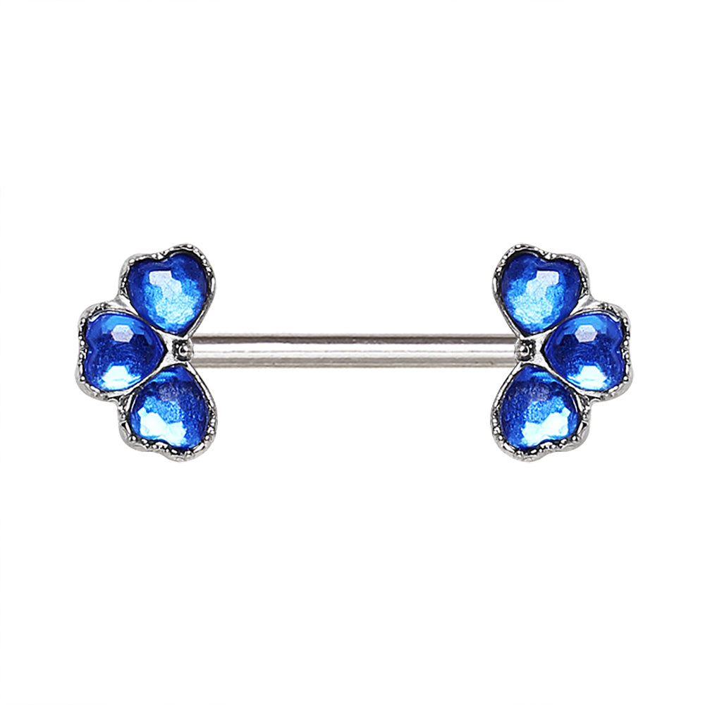 Pair of blue flower-shaped nipple bars on a white background