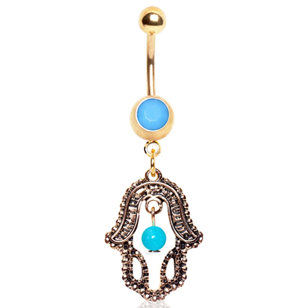 Styled flat lay of antique gold hamsa turquoise dangle navel ring, spiritual boho belly jewelry
