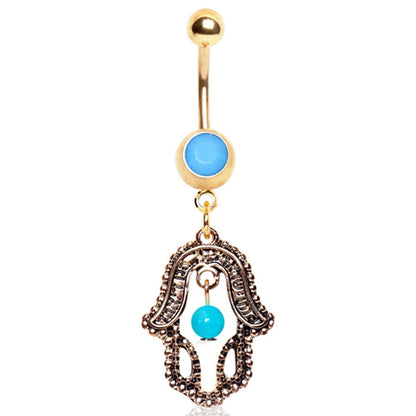 Styled flat lay of antique gold hamsa turquoise dangle navel ring, spiritual boho belly jewelry
