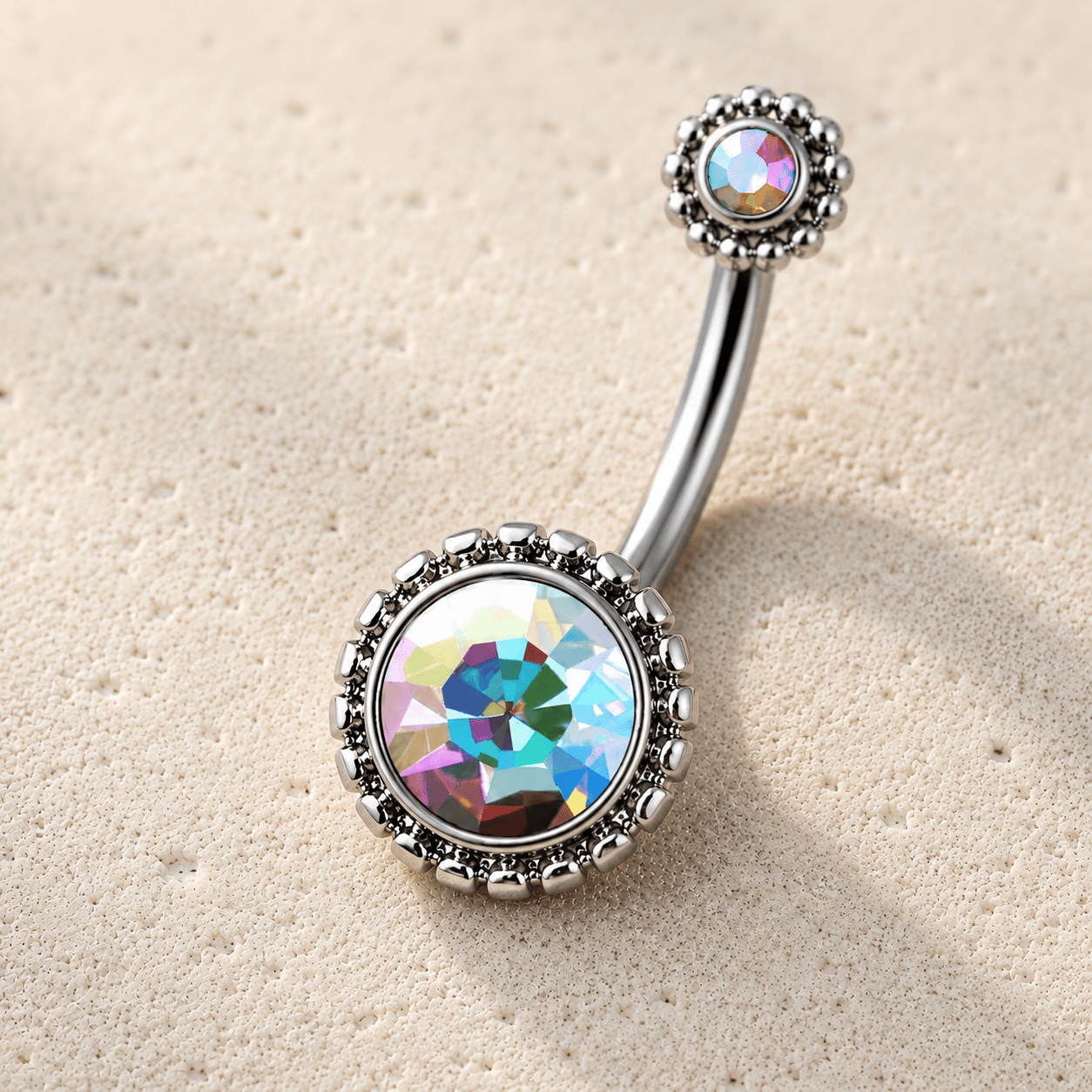 Multicolored gemstone belly button ring on a beige background