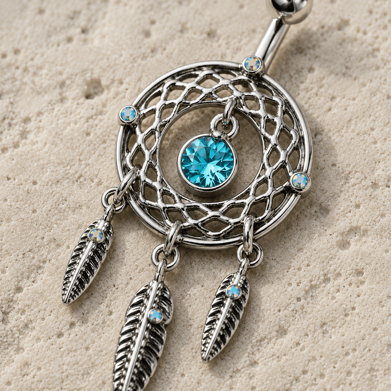 Close up of aqua CZ dream catcher design and dangling feathers, aurora sparkle detail