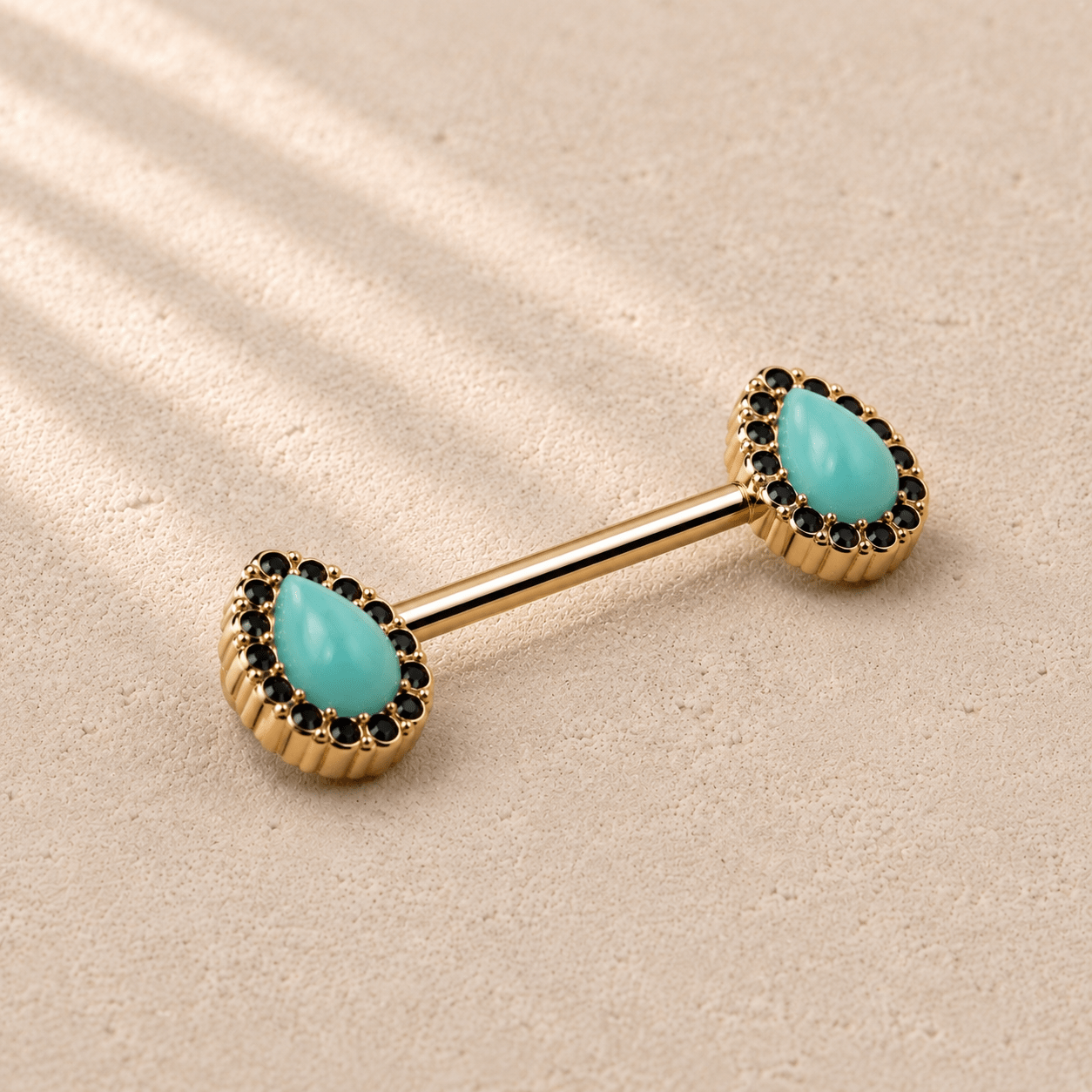 Side view of gold plated aqua teardrop nipple barbell, 14G externally threaded yellow gold stainless steel pair