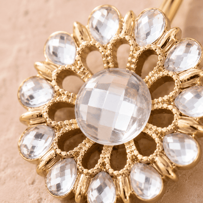 Close up of checkerboard cut clear CZ gems on gold plated flower navel ring, maximum sparkle yellow gold detail