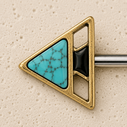 Nipple rings barbell  with turquoise stone and gold frame on a beige background