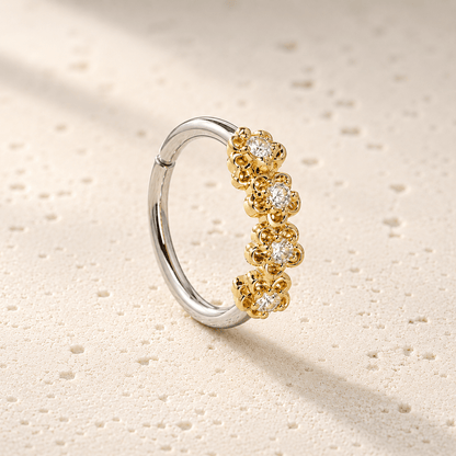 Side view of golden flowers seamless circular ring, 16G gold plated 316L steel 10mm diameter