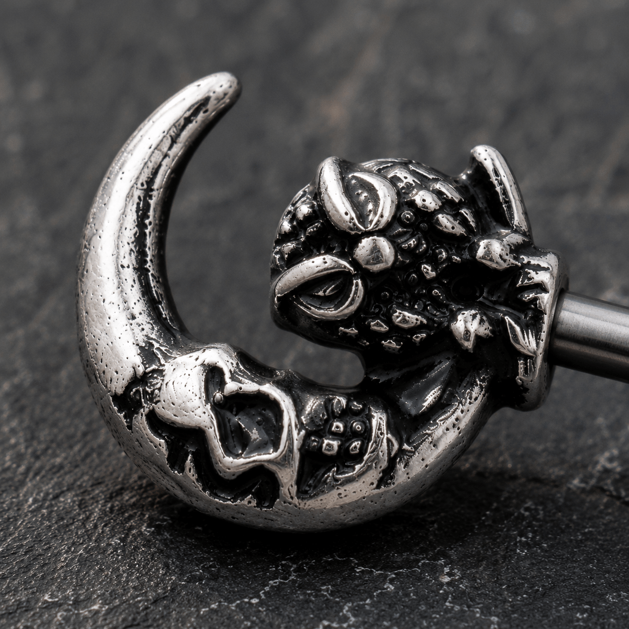 Close up of gothic owl crescent moon skeleton key design on nipple bar, 316L stainless steel zinc alloy detail