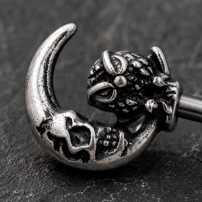 Close up of gothic owl crescent moon skeleton key design on nipple bar, 316L stainless steel zinc alloy detail