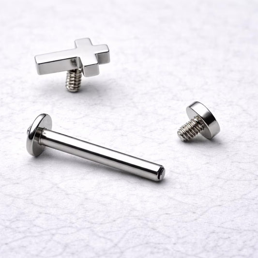 Cross labret stud parts disassembled, internally threaded 316L stainless steel bar and cross top detail