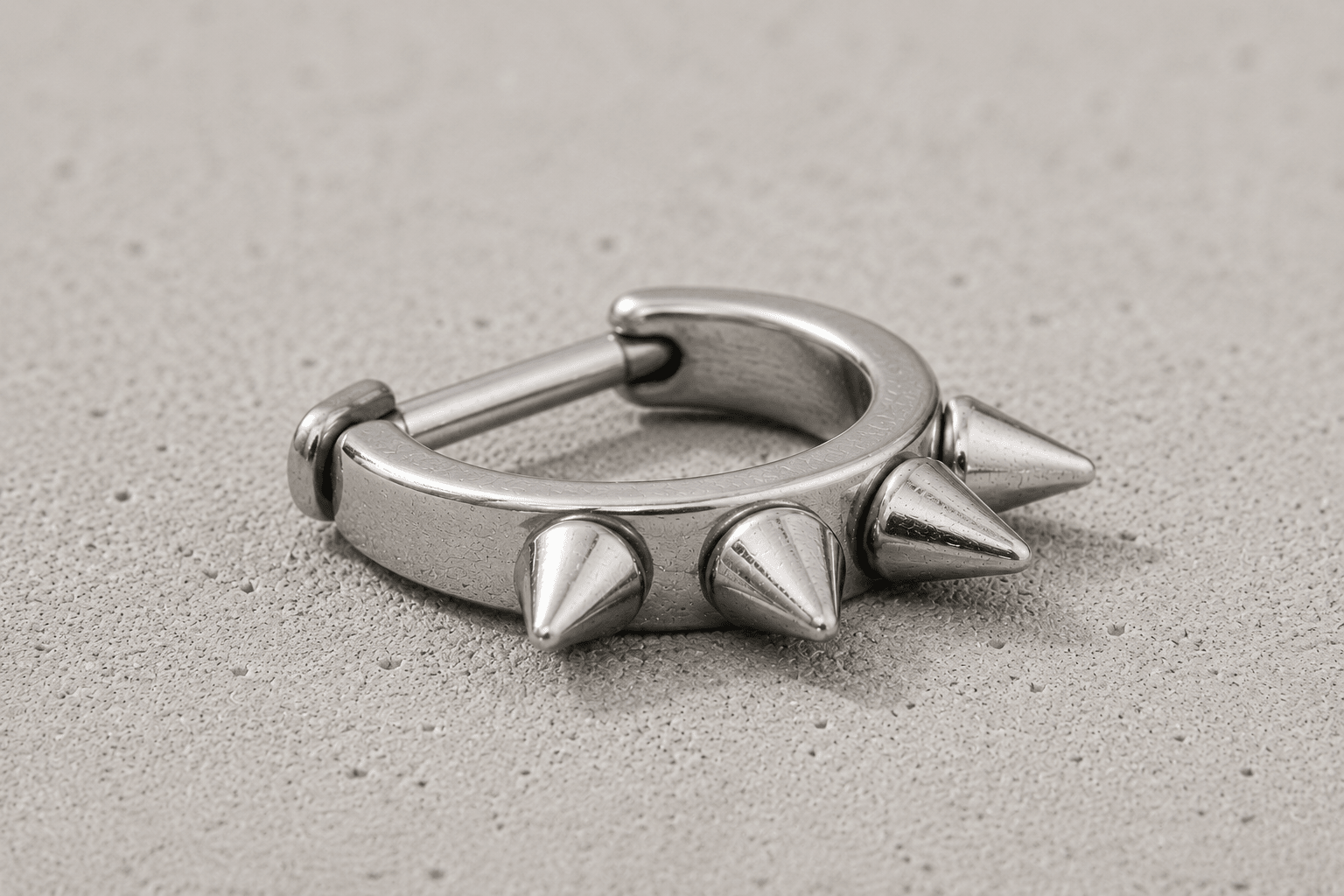 cartilage cuff with spike detailing on a concrete surface