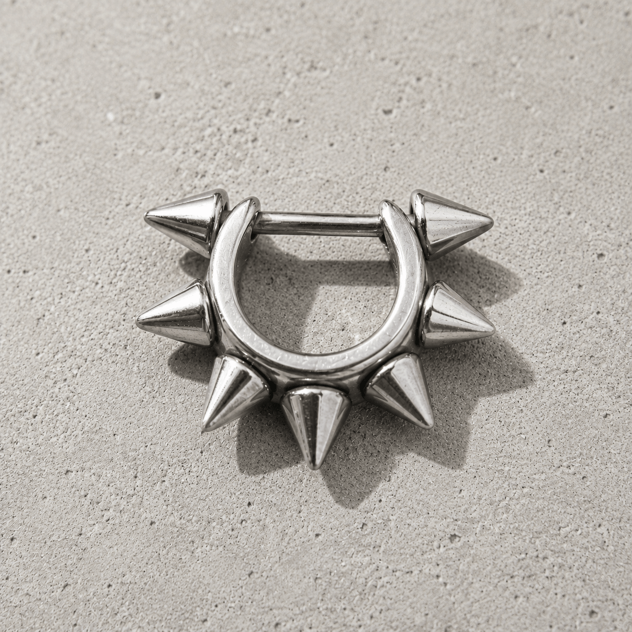 cartilage cuff with spike detailing on a concrete surface