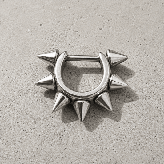 cartilage cuff with spike detailing on a concrete surface