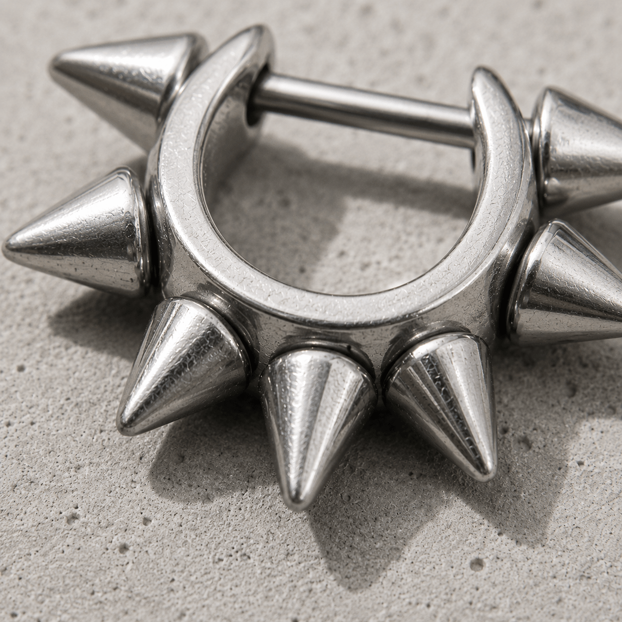 cartilage cuff with spike detailing on a concrete surface