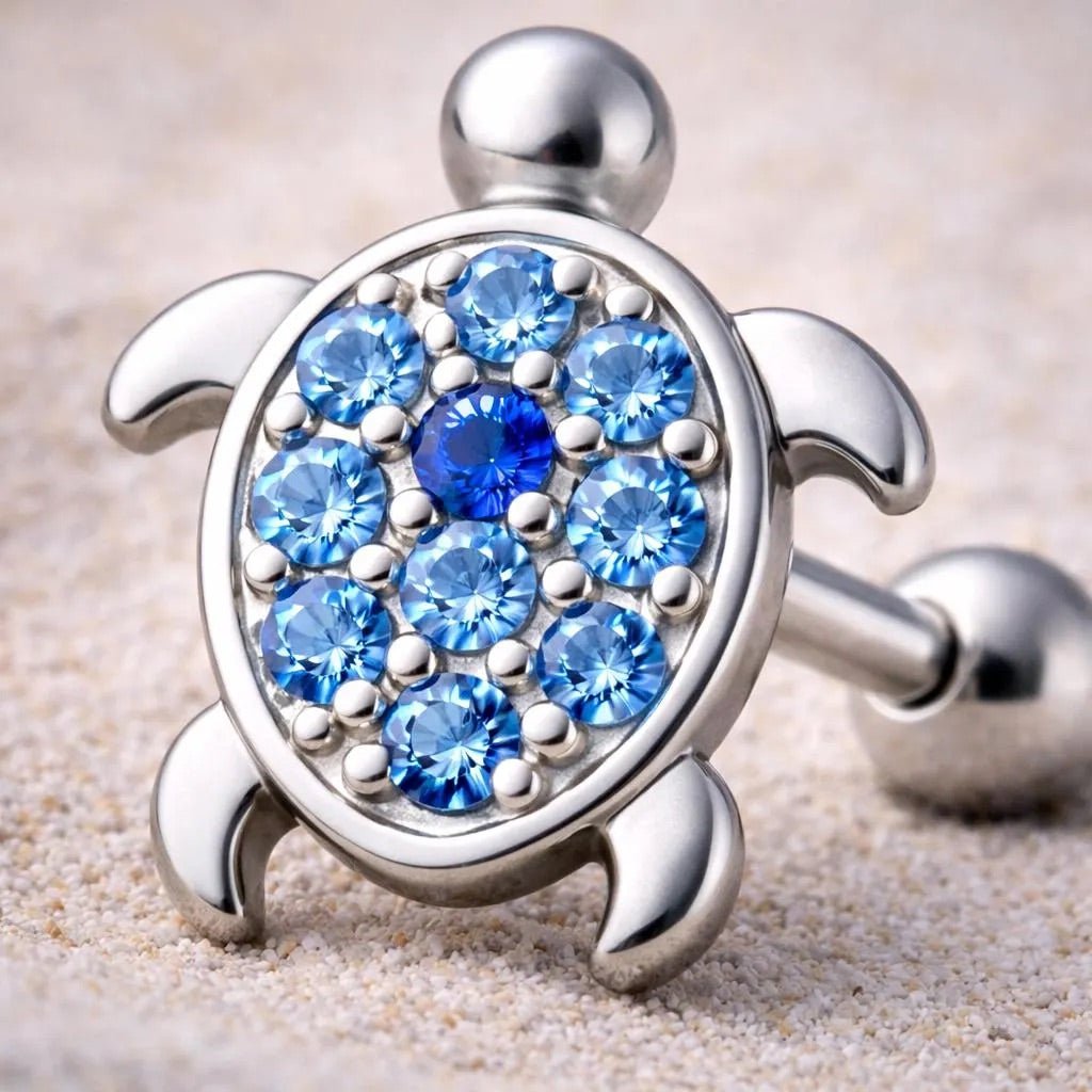 Close up of blue and light blue CZ on turtle shell cartilage earring, zinc alloy detail