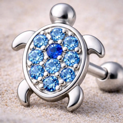 Close up of blue and light blue CZ on turtle shell cartilage earring, zinc alloy detail