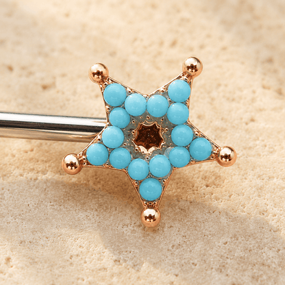 Close up of turquoise beads on rose gold plated moon and star nipple bar, gold plated zinc alloy celestial detail