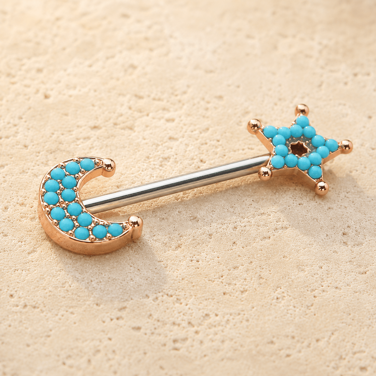 Side view of rose gold moon star nipple barbell, 14G 316L stainless steel shaft, 12.5mm wearable bar length