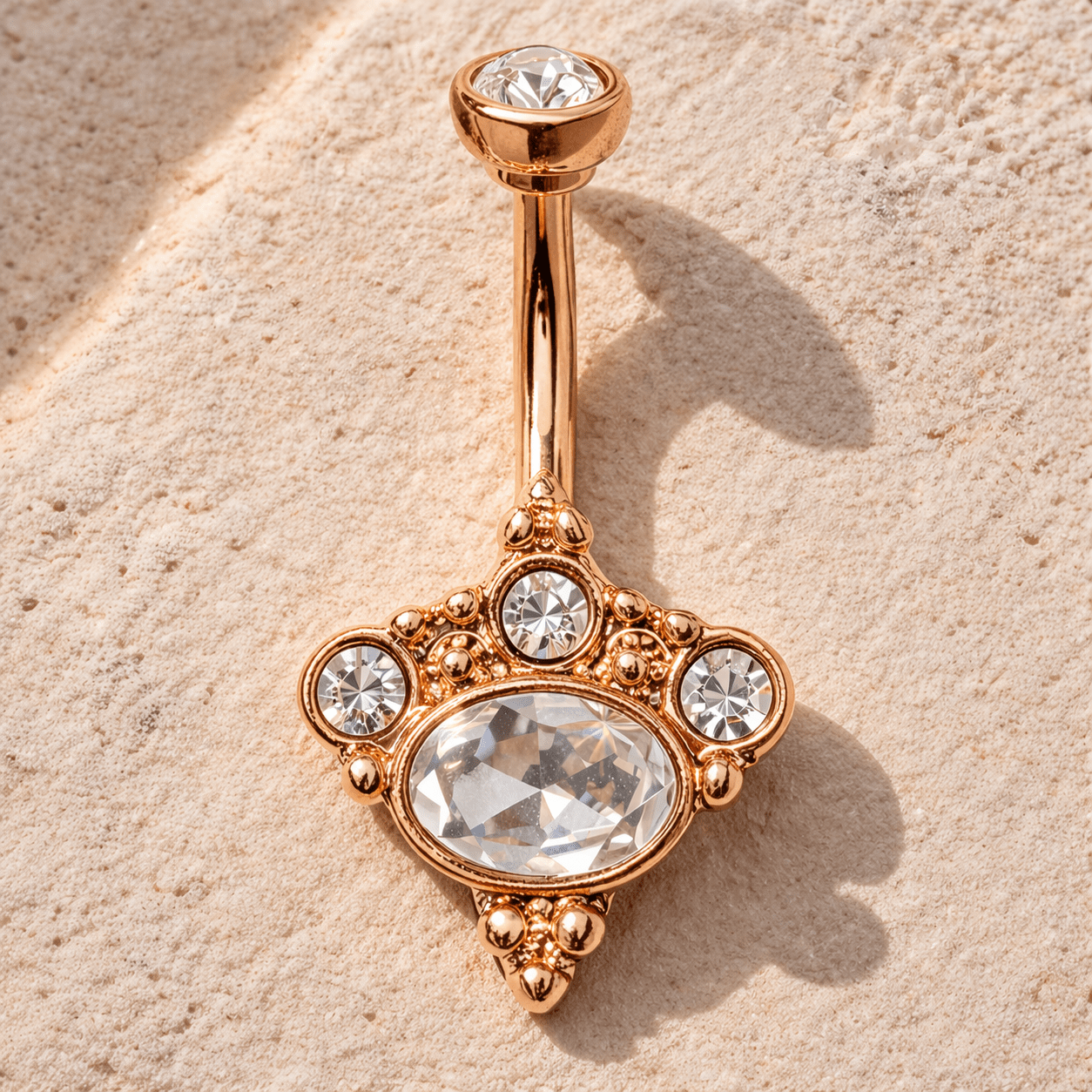 Rose gold Victorian navel ring styled flat lay, romantic vintage inspired belly button ring, clear CZ gems