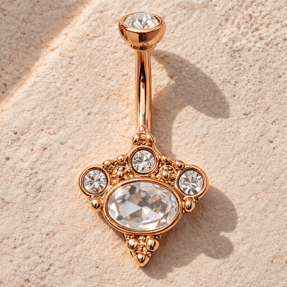 Rose gold Victorian navel ring styled flat lay, romantic vintage inspired belly button ring, clear CZ gems
