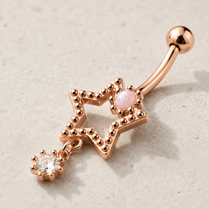 Side view of rose gold star drop navel ring, 14G externally threaded 316L stainless steel, dangling CZ star