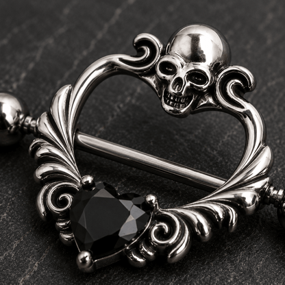 Close up of skull design top and black heart CZ on heart shaped nipple shield detail