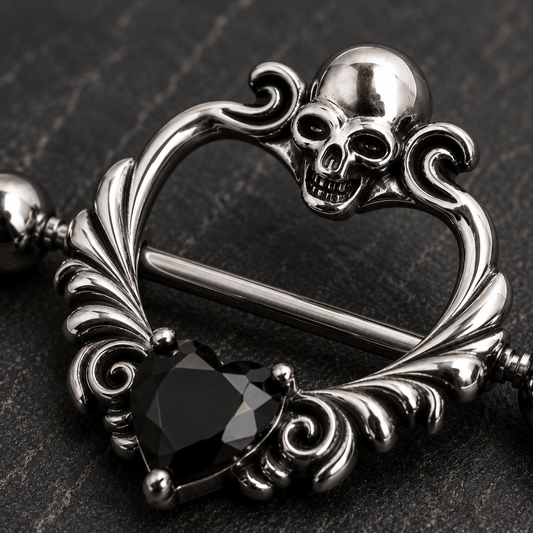 Close up of skull design top and black heart CZ on heart shaped nipple shield detail