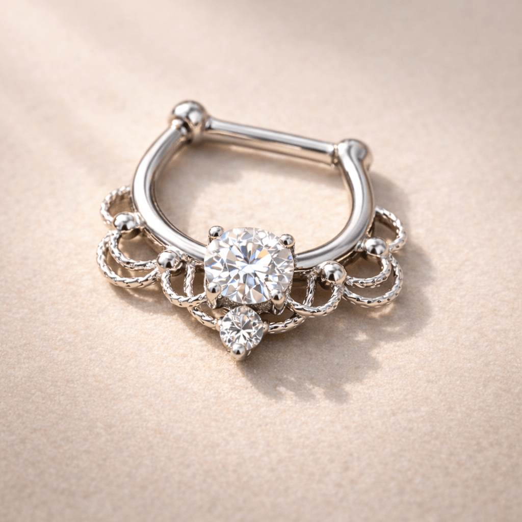 Silver septum ring with gemstones on a beige background