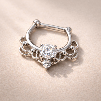 Silver septum ring with gemstones on a beige background