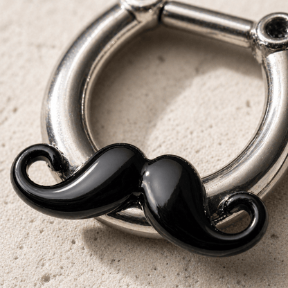 Close up of gleaming black mustache design on septum clicker, PVD plated copper detail