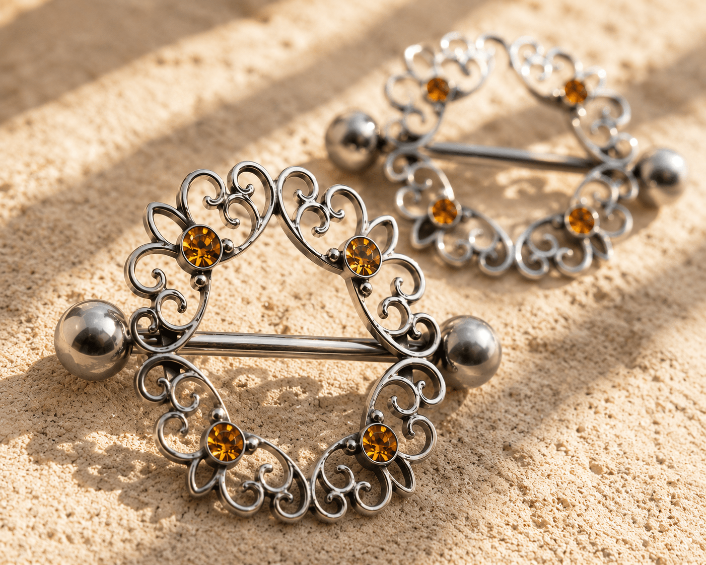 Topaz CZ ornate nipple shield pair on white background, 14G four topaz CZ 316L stainless steel body jewelry