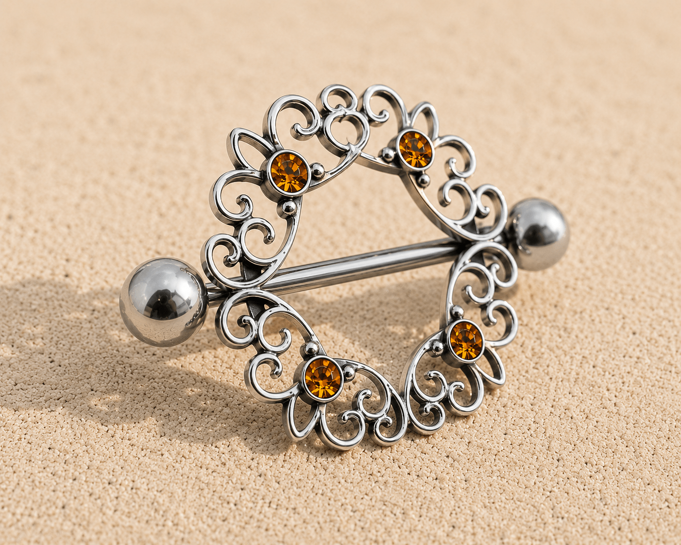 Side view of topaz CZ ornate nipple shield, 14G externally threaded 316L stainless steel, 14mm wearable size