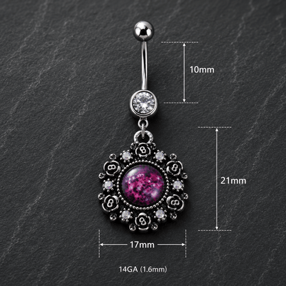 Belly button ring with floral design and purple gemstone on a dark surface, showing measurements.