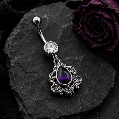 Styled flat lay of Victorian purple teardrop dangle navel ring, dramatic regal purple CZ belly jewelry
