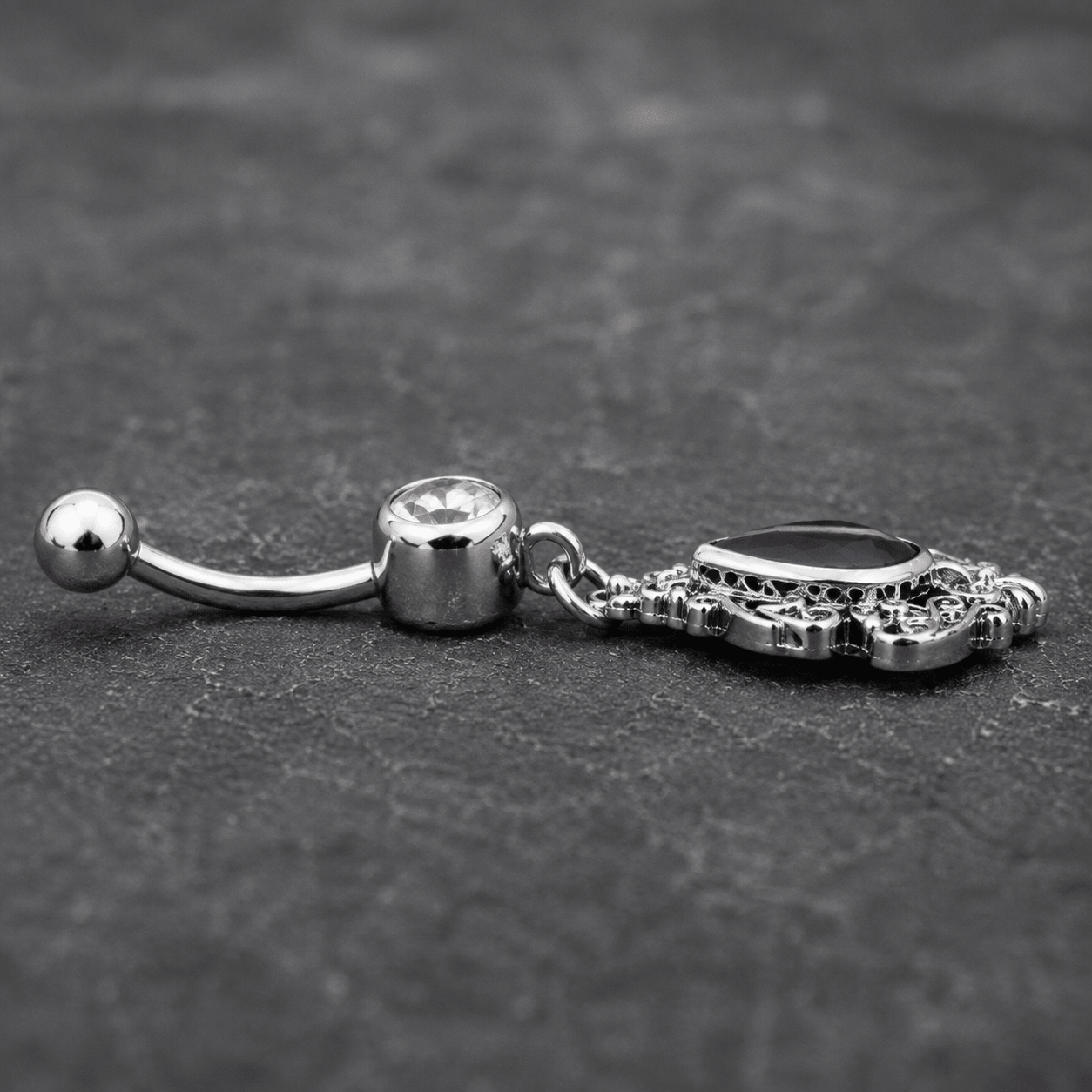 Side view of Victorian purple teardrop dangle navel ring, 14G 316L stainless steel 18mm bar length
